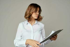 Business woman in white shirt documents work official photo