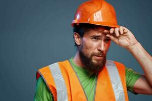 Angry man in work uniform orange paint safety hard work cropped view photo