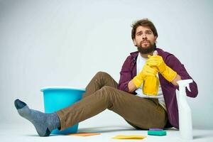 cleaner lying on the floor with a bucket of detergent cleaning service rendering Professional photo