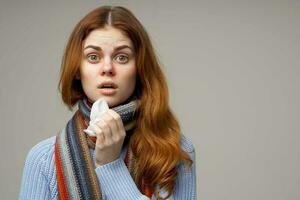 red-haired woman cold handkerchief close-up photo