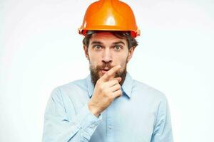 Man in orange helmet shirt construction engineer industry work photo