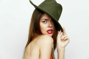 Elegant woman green hat glamor red lips photo