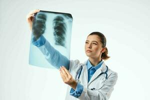 female doctor x-ray white coat examination light background photo