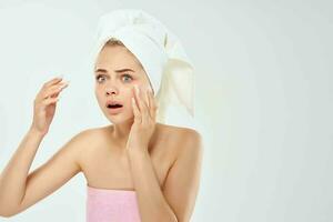 pretty woman with a towel on her head skin problems dermatology photo