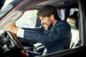 bearded man Driving a car trip luxury lifestyle service photo