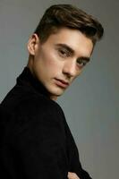 handsome young guy fashionable hairstyle attractive look black jacket close-up luxury photo