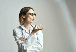 portrait of female doctor in medical gown and blue stethoscope cropped view photo