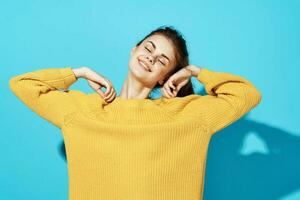 pretty woman in yellow sweater smile Studio moda clothes photo