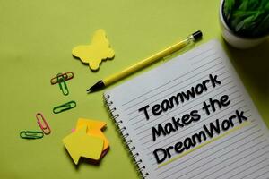 Teamwork Makes The Dreamwork write on a book isolated on office desk. photo