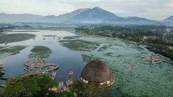 Aerial view of Situ Bagendit is a famous tourist spot in Garut with mountain view. Garut, Indonesia, May 19, 2022 photo