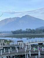 Aerial view of Situ Bagendit is a famous tourist spot in Garut with mountain view. Garut, Indonesia, May 19, 2022 photo