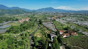 Aerial view of The Taman Bunga Nusantara or Flower Garden Nusantara, a travel destination located in Cianjur. Cianjur, Indonesia, July 6, 2022 photo