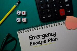 Emergency Escape Plan write on a book isolated on Office Desk photo