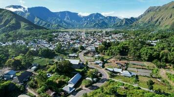 Aerial view of some agricultural fields in Sembalun. Sembalun is situated on the slope of mount Rinjani and is surrounded by beautiful green mountains. Lombok, Indonesia, March 22, 2022 photo