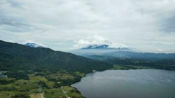 Aerial view of Danau Singkarak. Singkarak lake is one of the beautiful lake located in West Sumatera attracting thousands of tourists. Sumatra, Indonesia, January 25, 2023 photo