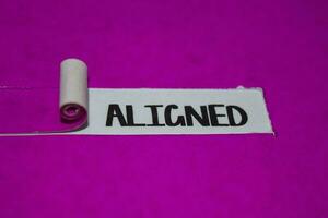 Aligned text, Inspiration and positive vibes concept on purple torn paper photo