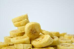 Close up slice yellow banana isolated on white background photo