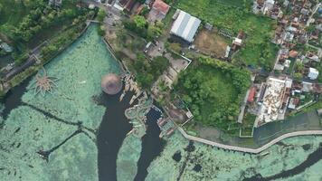 Aerial view of Situ Bagendit is a famous tourist spot in Garut with mountain view. Garut, Indonesia, May 19, 2022 photo