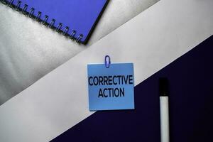 Corrective Action text on sticky notes with color office desk concept photo