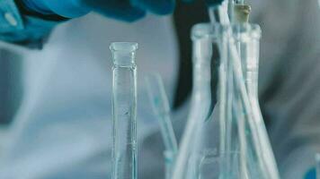 Medical Research LaboratoryPortrait of a Beautiful Female Scientist in Goggles Using Micro Pipette for Test Analysis. Advanced Scientific Lab for Medicine, Biotechnology, Microbiology Development video