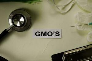 GMOs with inspiration and healthcare medical concept on desk background photo