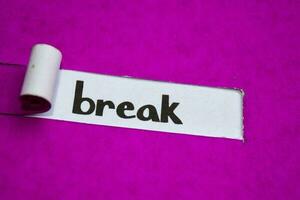 Break text, Inspiration, Motivation and business concept on purple torn paper photo