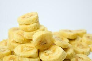 Close up slice yellow banana isolated on white background photo