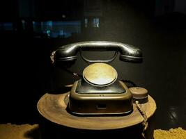 Vintage old telephone antique with conceptual still life in Museum Mandiri. JAKARTA, INDONESIA, APRIl 8, 2019 photo