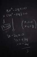 Close up math formulas written on a blackboard. Education concept photo