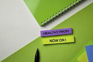 Healthy From Now ON text on top view office desk table of Business workplace and business objects. photo