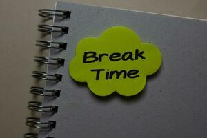 Break Time write on a sticky note isolated on office desk. photo