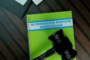 The book of Alternative Dispute Resolution isolated on Wooden Table. Law concept photo