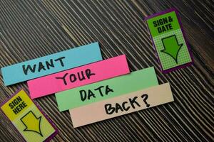 Want Your Data Back write on sticky notes isolated on office desk. photo