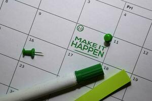 Make it Happen text on white calendar background. Reminder or schedule concept photo