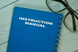 The Book of Instruction Manual on office desk. photo