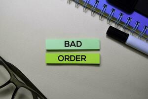 Bad Order text on sticky notes isolated on office desk photo