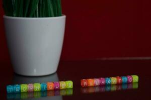 Techniques relaxation text at colorful wooden block on red background. Desk office and education concept photo