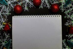 Decorative Christmas and a book. put into your text. isolated on dark background photo