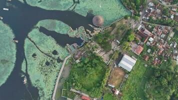 Aerial view of Situ Bagendit is a famous tourist spot in Garut with mountain view. Garut, Indonesia, May 19, 2022 photo