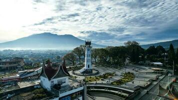 Aerial view of Jam Gadang, a historical and most famous landmark in BukitTinggi City, an icon of the city and the most visited tourist destination by tourists. Bukittinggi, Indonesia, January 25, 2023 photo