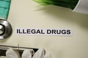 Illegal Drugs with inspiration and healthcare medical concept on desk background photo