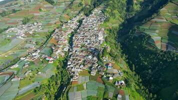 Aerial view of the Nepal van java is a Rural tour on the slopes of mount sumbing, The beauty of building houses in the countryside of the mountainside. Magelang, Indonesia, December 6, 2021 photo