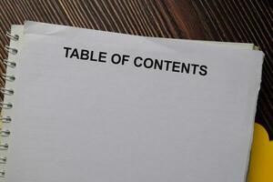 Table of Contents write on a paperwork isolated on wooden table. photo