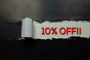 Close up text 10 percent OFF write on brown torn paper photo