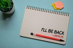 I'll Be Back - Jesus write on a book isolated on office desk. Christian faith concept photo