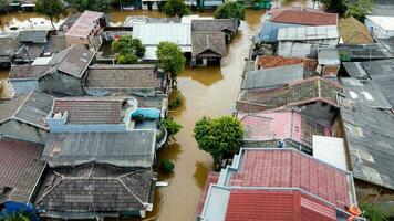 Aerial POV view Depiction of flooding. devastation wrought after massive natural disasters at Bekasi - Indonesia photo