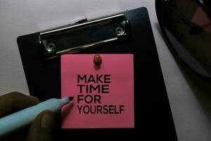 Make Time For Yourself text on sticky notes isolated on office desk photo