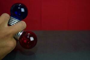 Close up lamp in red background and black table photo