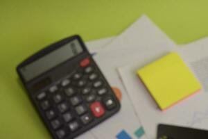 Blur and defocused calculate about cost and doing finance at home office. Business and Finance Concept photo