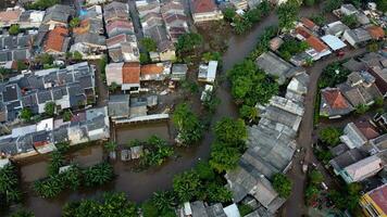 Aerial POV view Depiction of flooding. devastation wrought after massive natural disasters at Bekasi - Indonesia photo